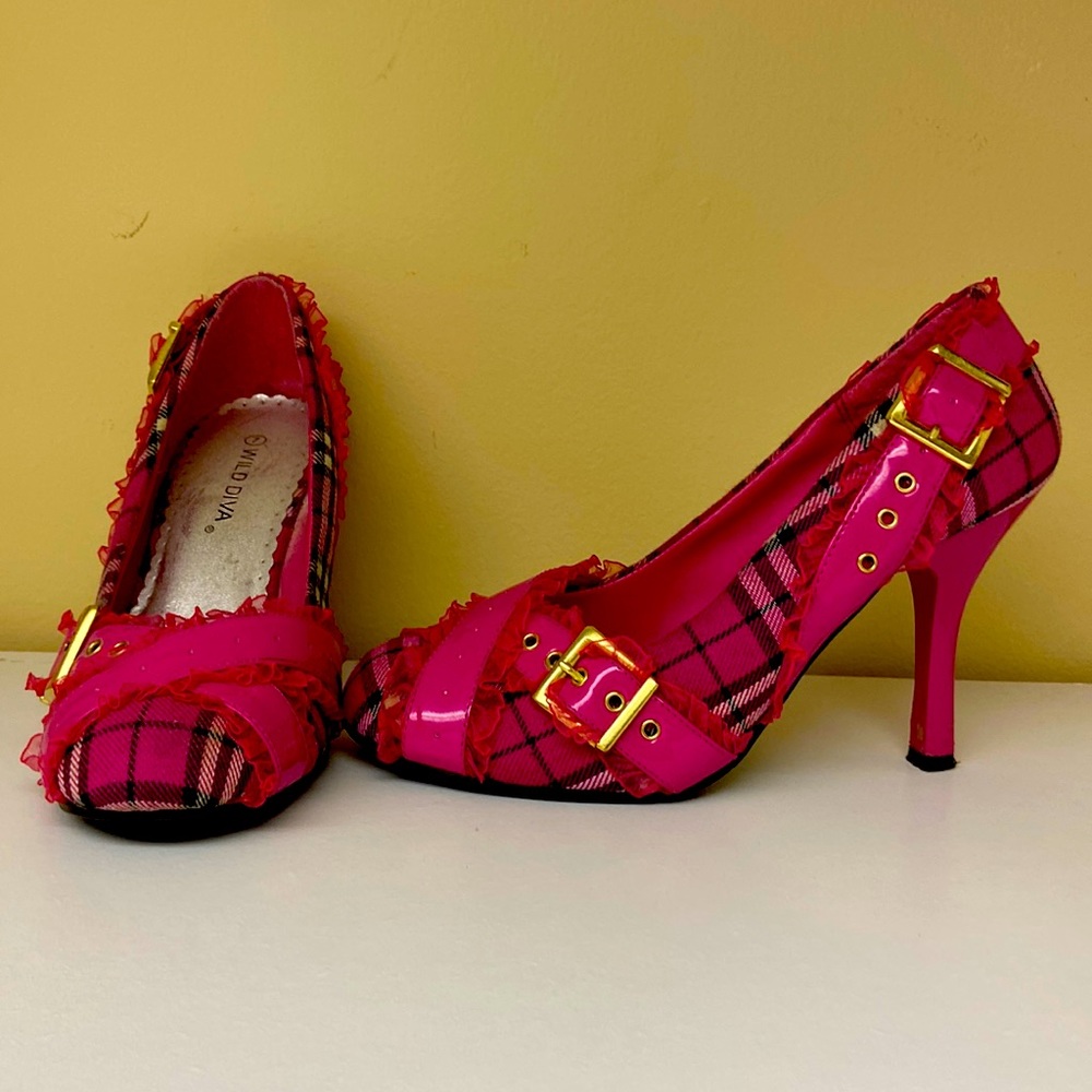 Pink high heels with gold buckle